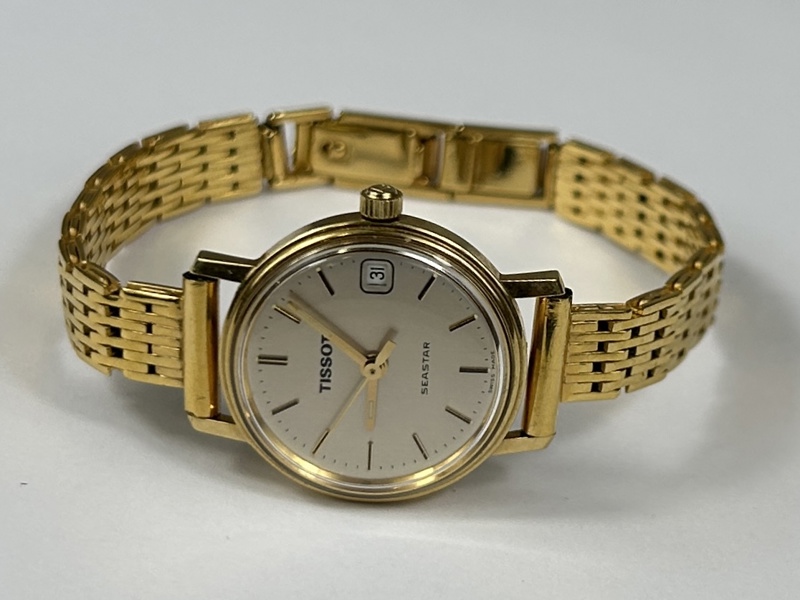 Tissot. Damarmbandsur, 18k guld.