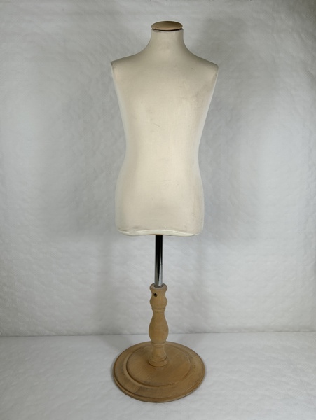 Provdocka, textilbeklädd.