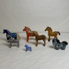 Hästar, trä, bl a Dalahästar.