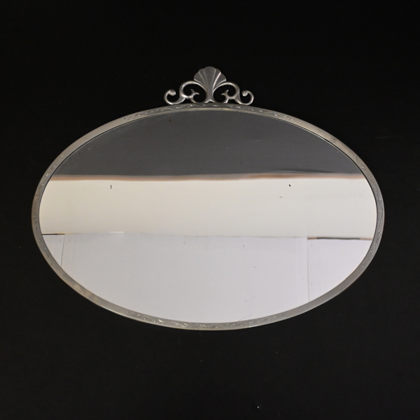 Spegel i tenn, 1900-talets första hälft.