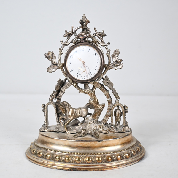 Fickurställ, med fickur, silver, 1900-talets första hälft. 
