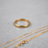 Halsband och ring i 18k guld.