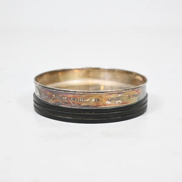 Coaster, bakelit och silver, 830.