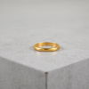 Ring i 23k guld.