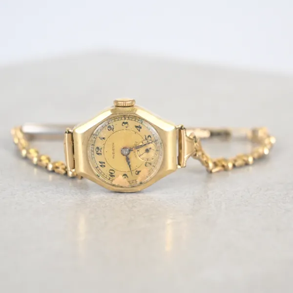 Damarmbandsur, 14k guld, Huguenin.