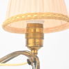 Vägglampa, mässing, 1900-talets första hälft.