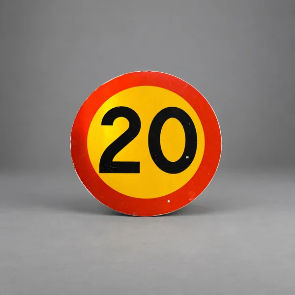 Vägskylt, hastighetsbegränsning 20 km/h.