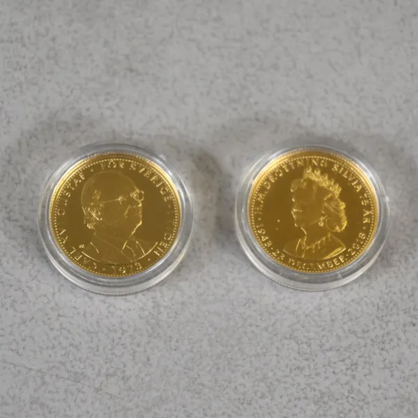 Medaljer, 2st, 24k guld, Kungariket Sverige.